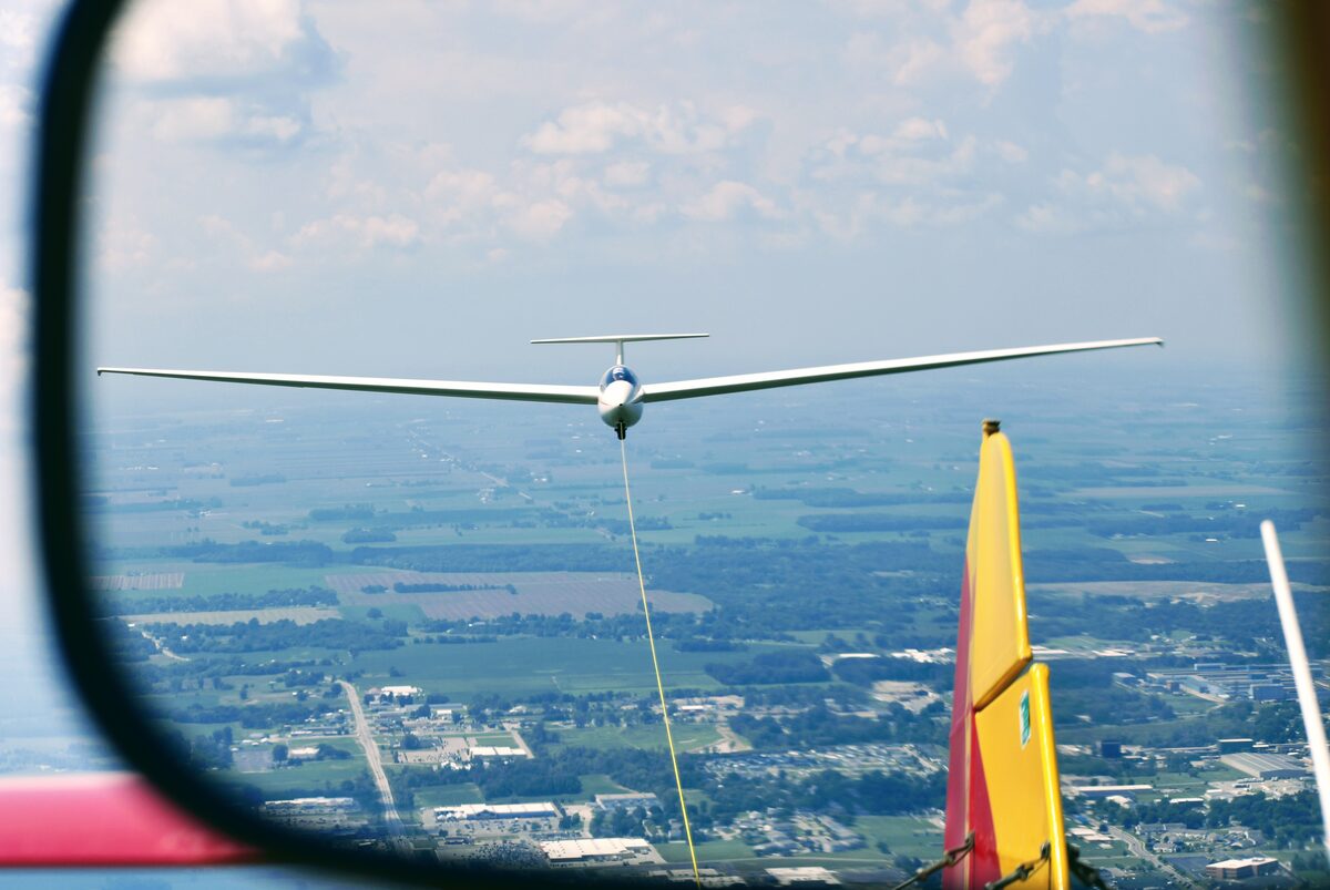 Glider being towed over Michigan farmland